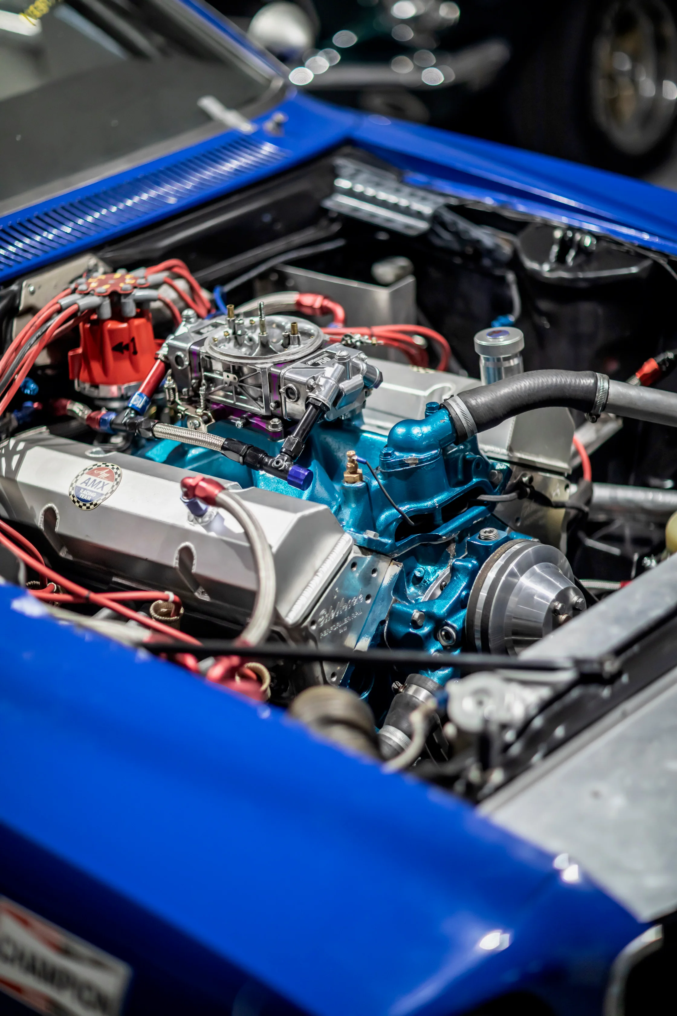 Close-up of a blue classic car engine in the workshop
