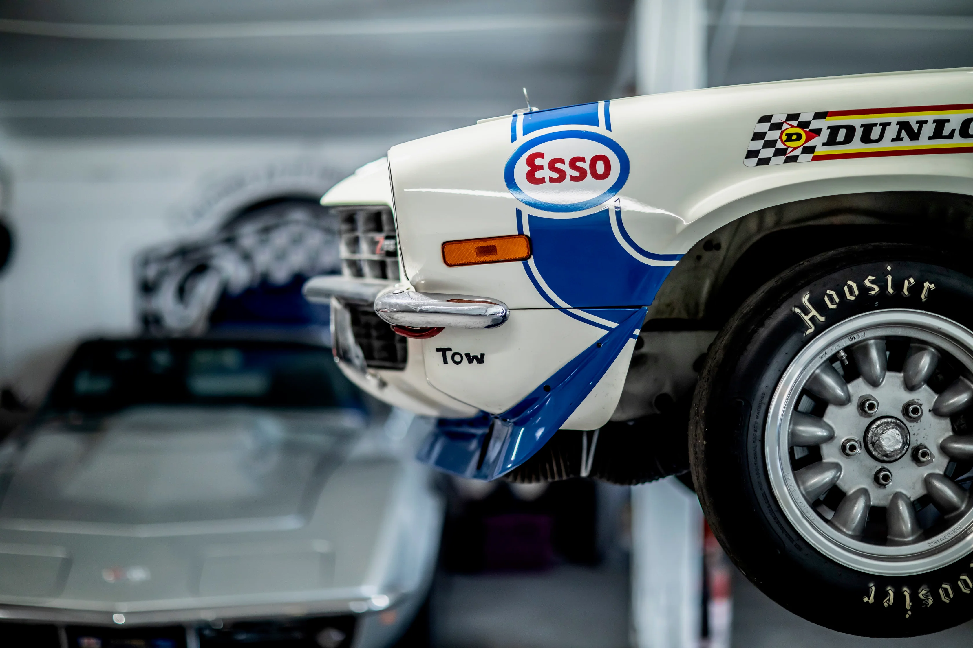 Wheel and racing livery of a white workshop car