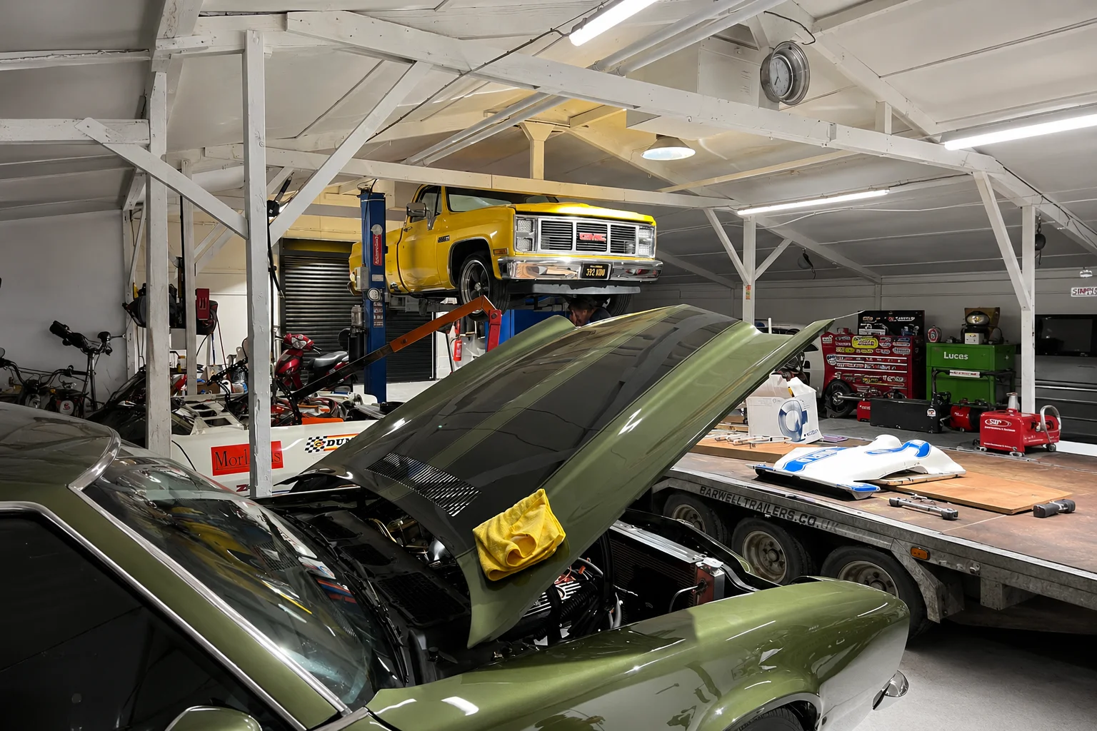 American cars being serviced inside The Paddock Club workshop