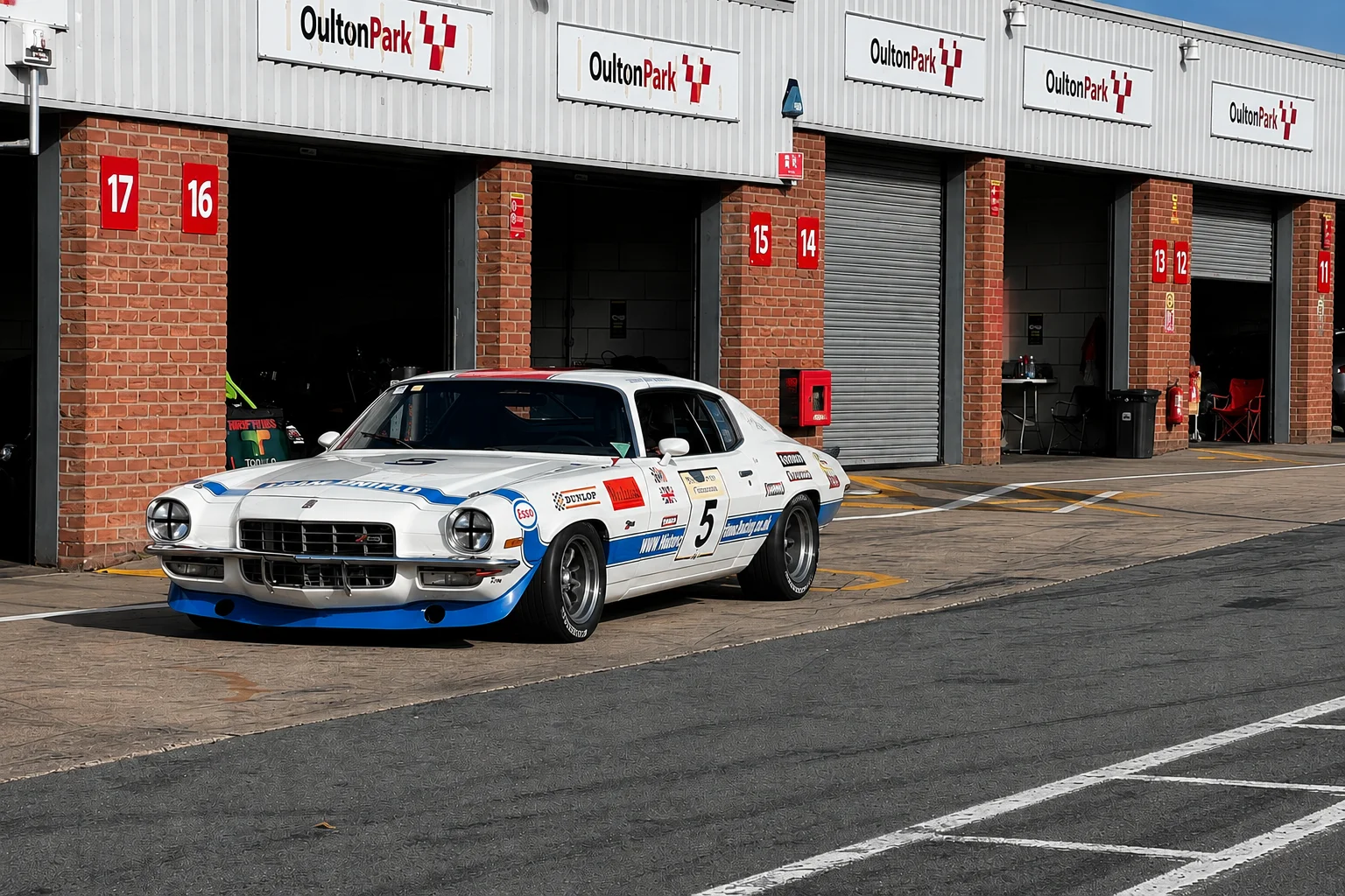 A car being prepared and loaded at the paddock