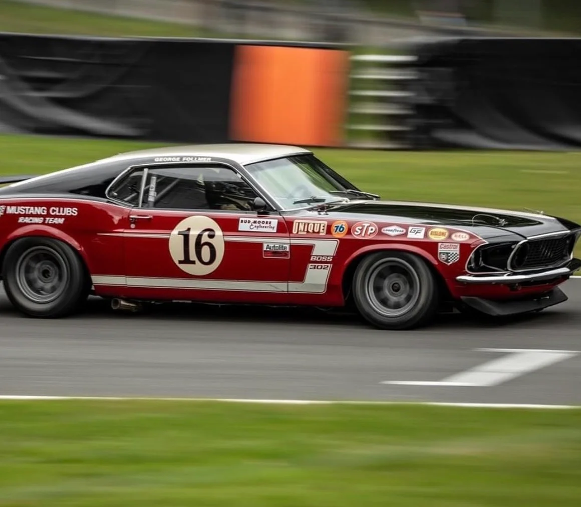 Classic Ford Mustang racing on track